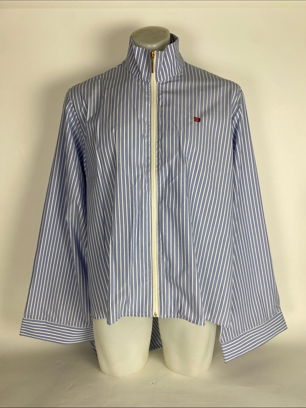 Namesake brand zip-front shirt features blue and white vertical stripes SZ L